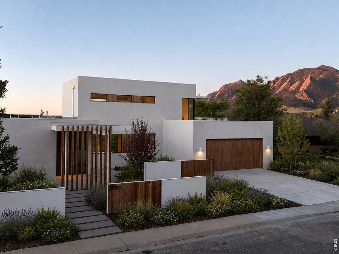 Front elevation of 1750 Sunset Blvd at golden hour with the Flatirons behind